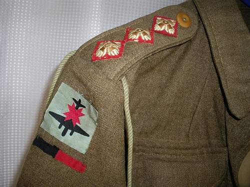 Insignia identification needed for WW2 uniform donated to hospice