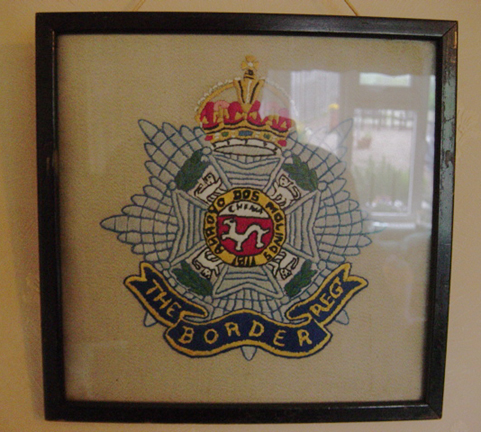 Framed Regimental cap badge embroideries