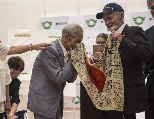 Marine Returns Japanese WWII Flag to Original Family