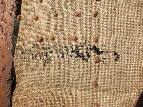 Japanese helmet, machine gun damage, japanese text inside cloth cover, translation?