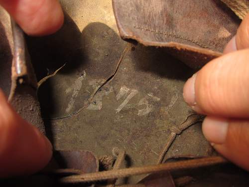 Japanese helmet, machine gun damage, japanese text inside cloth cover, translation?