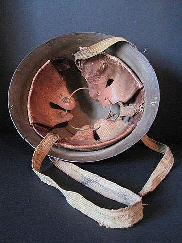 Two Japanese Army helmets from the battle of Attu