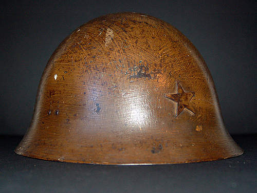 Two Japanese Army helmets from the battle of Attu