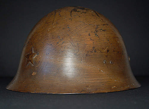 Two Japanese Army helmets from the battle of Attu