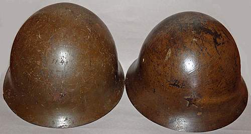 Two Japanese Army helmets from the battle of Attu