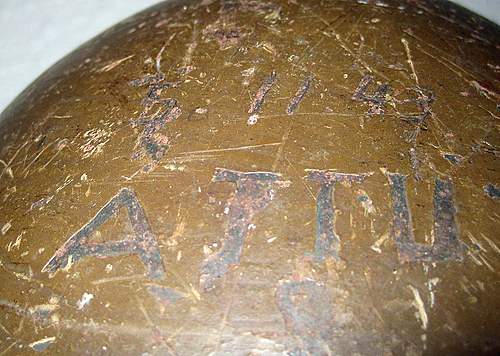 Two Japanese Army helmets from the battle of Attu