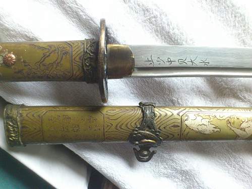 Are these 2 WW2 Katanas original or replika?