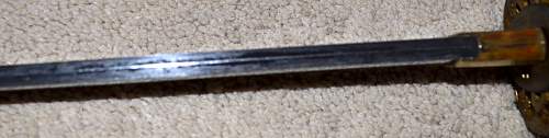 WW2 Japanese sword;need help with identification, please .