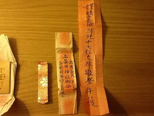 Is this a Senninbari (thousand stitch belt) and can anyone translate the writing?