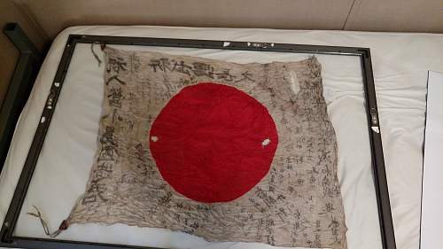 Japanese flag with a lot of Kanji... Is it from an aircraft?