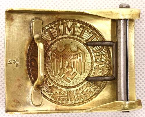 Need help : KM brass buckle.