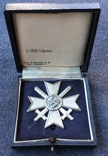 Kriegsverdienstkreuz 1.Klasse mit Schwertern. &quot;65&quot; cross in their cases.
