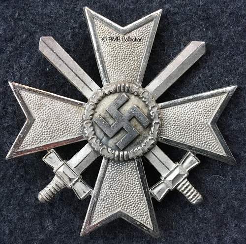 Kriegsverdienstkreuz 1.Klasse mit Schwertern. &quot;65&quot; cross in their cases.