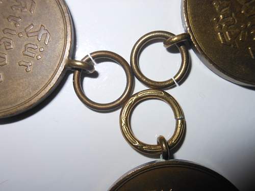 Kriegsverdienstmedaille with patterned suspension ring.