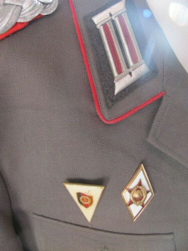Stasi tunic with red piping and gold cuff title?