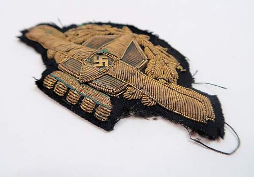 unidentified insignia - perhaps a private airline visor cap wreath &amp; swastika cockade?