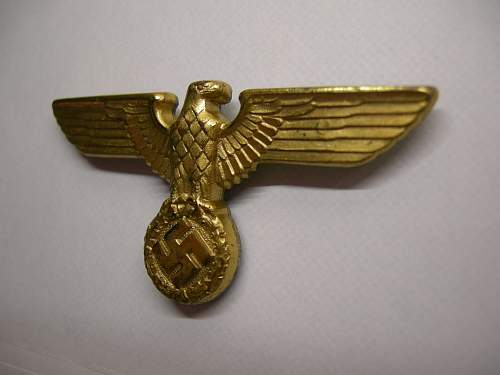 Gold political eagle insignia
