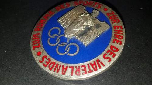 Olympic badge for sale.