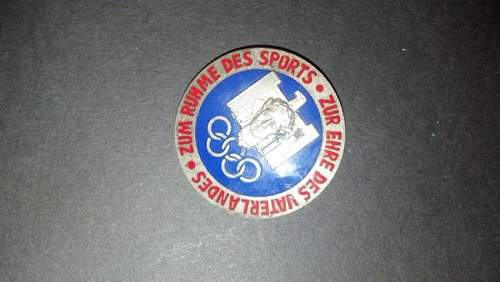 Olympic badge for sale.