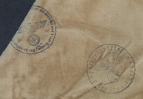 Need help with I.D. of stamps on black triangle armband