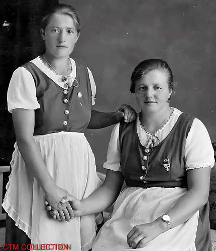 Photo of Austrian sisters wearing National Socialist pins and necklace