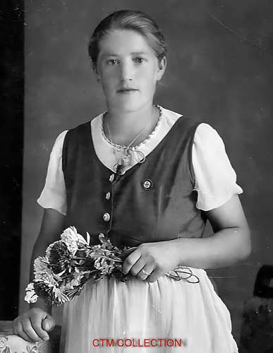 Photo of Austrian sisters wearing National Socialist pins and necklace