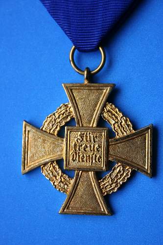 A 40 year service cross - fake?