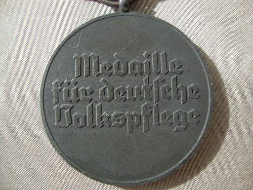 Volkspflege medaille and 8 mm pin