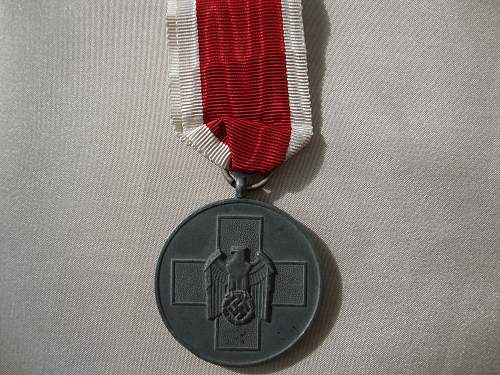 Volkspflege medaille and 8 mm pin