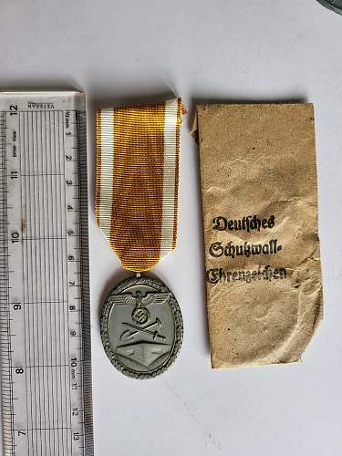 Advice on whether items are real or fake and in what case what an item is (Black Wound Badge, West Wall Medal, Kriegsverdienst Medal)