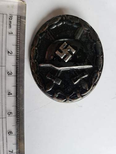 Advice on whether items are real or fake and in what case what an item is (Black Wound Badge, West Wall Medal, Kriegsverdienst Medal)