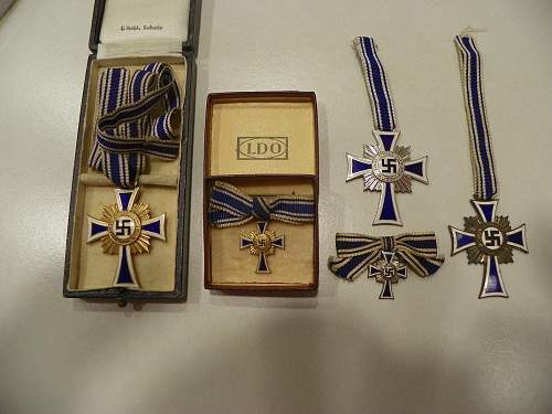 My new cased Ehrenkreuz der Deutschen Mutter in gold one uncased silver and small one in box in gold