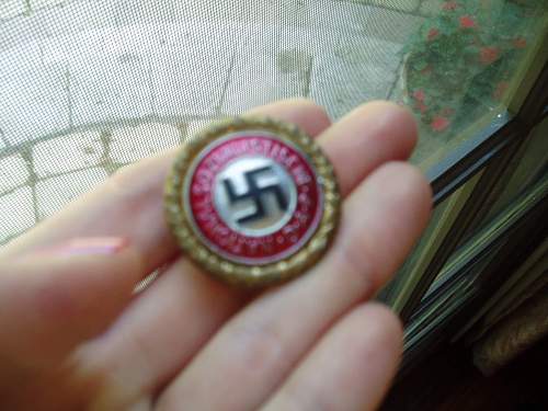 I think this is an authentic NSDAP Gold party badge sales sample.....