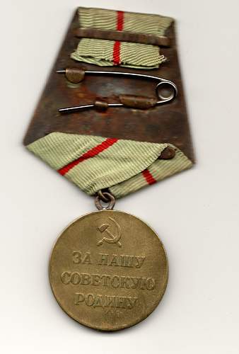 Im trying to find out about this Russian award, booklet and medal