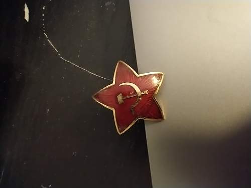 Is this soviet cap badge real?