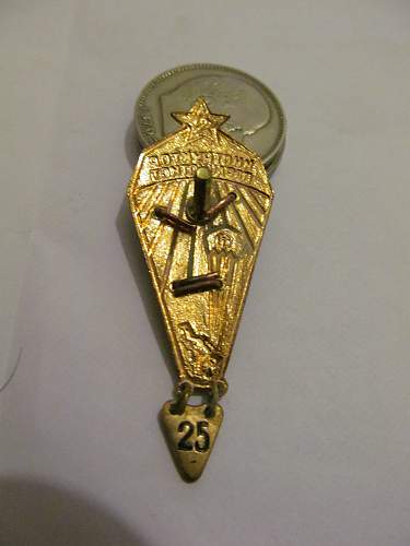 Help identifying Soviet badges and possible values.