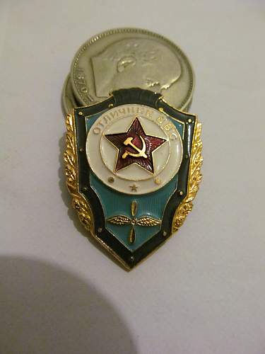 Help identifying Soviet badges and possible values.