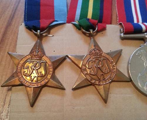NZ group of medals. The Pacific star, BWM, 1939-45 Star, and NZ war service medal. And discharge paper.