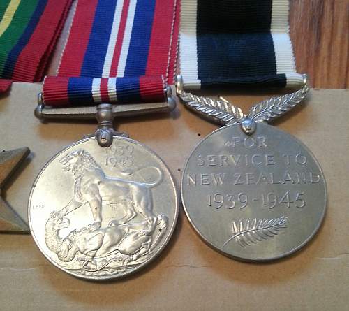 NZ group of medals. The Pacific star, BWM, 1939-45 Star, and NZ war service medal. And discharge paper.