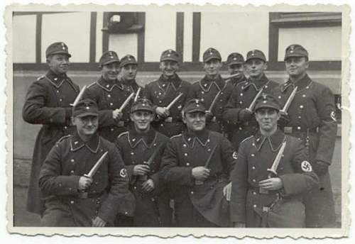 Original photos showing daggers/swords in wear.