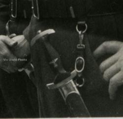 Original photos showing daggers/swords in wear.