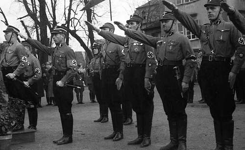 Original photos showing daggers/swords in wear.