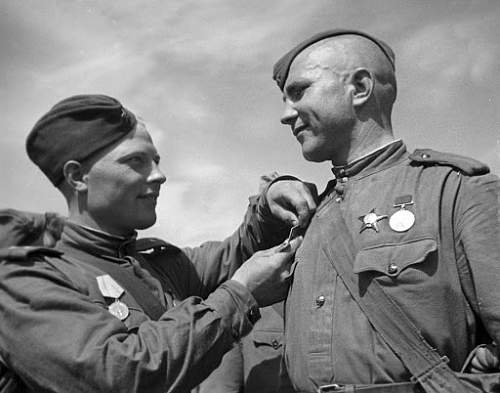 Any photos of a Soviet soldier wearing a medal during combat?