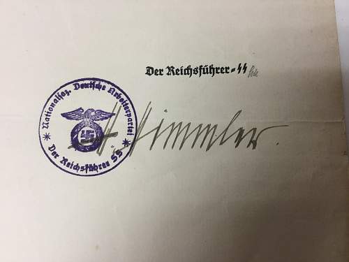 Himmler signed promotion documents.