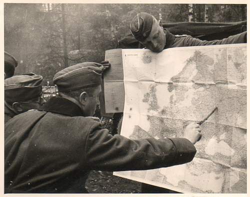 Looking for the right path. Photos of German soldiers with maps.... with humor