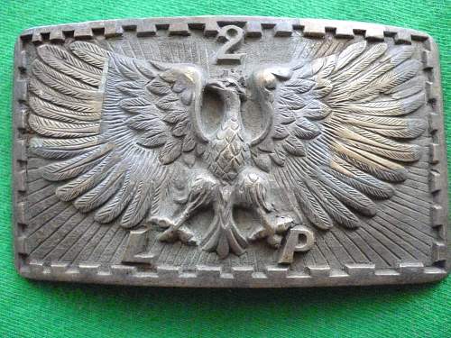 Polish and American belt buckles from the 2nd Republic era.