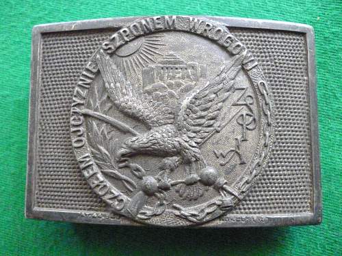 Polish and American belt buckles from the 2nd Republic era.