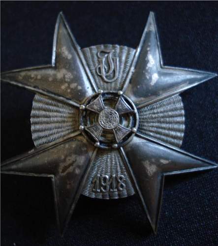 Odd WWI Polish Lancer Badge with design papers