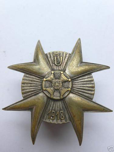 Odd WWI Polish Lancer Badge with design papers