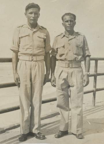 Need your help for identify soldier on photo (inside truck)